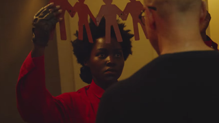 Lupita Nyong'o slipped back into her old <i>Us </i>jumpsuit to scare the crap out of theme park fans
